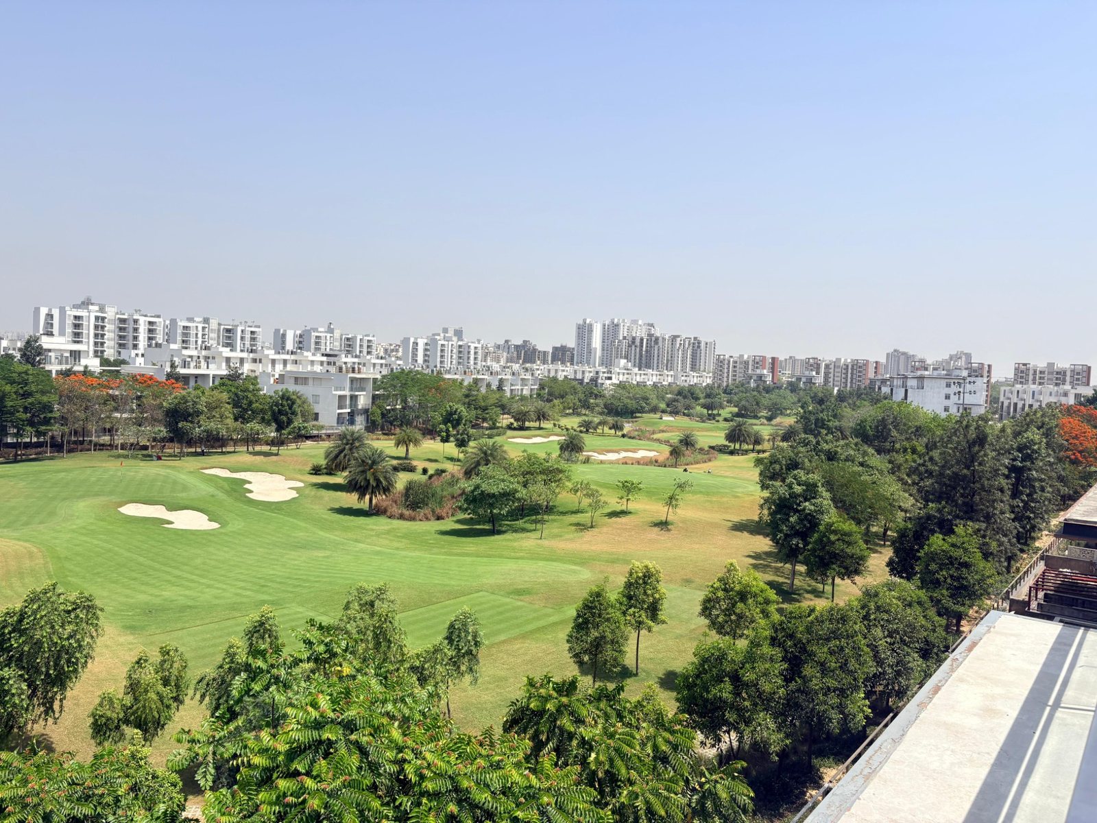 Large green golf course and landscaped township views